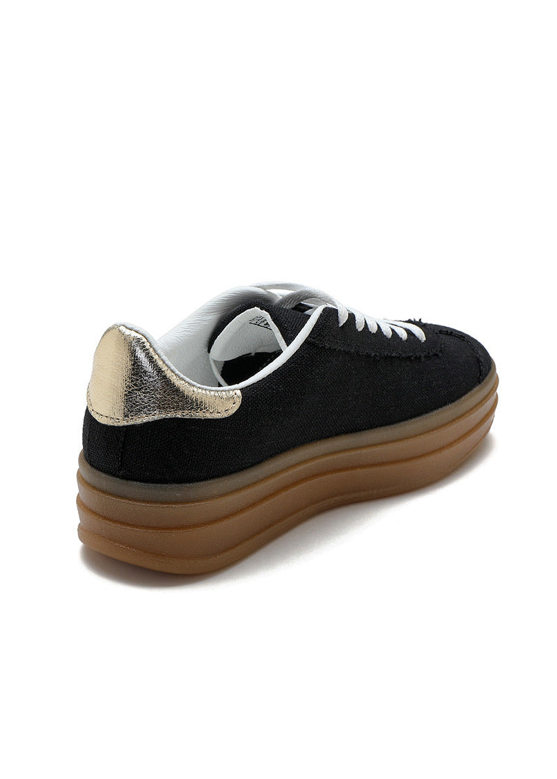 Baskets noires pour femme avec semelle plateforme beige, lacets blancs, cœur doré brodé sur le côté et détail métallisé au talon. Modèle confortable et tendance signé Timalya prêt-à-porter.
