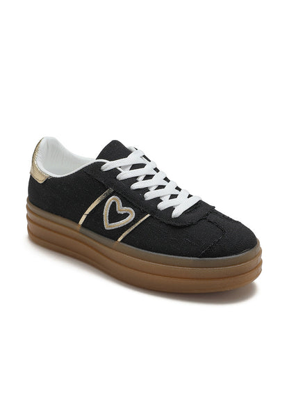 Baskets noires pour femme avec semelle plateforme beige, lacets blancs, cœur doré brodé sur le côté et détail métallisé au talon. Modèle confortable et tendance signé Timalya prêt-à-porter.