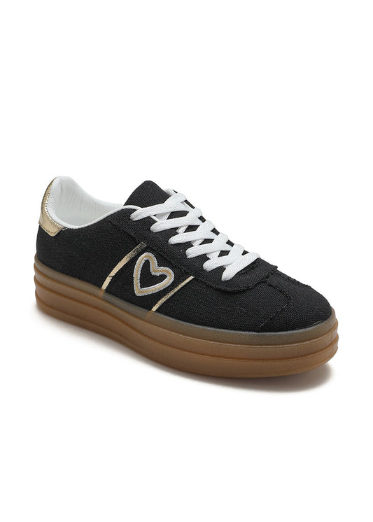 Baskets noires pour femme avec semelle plateforme beige, lacets blancs, cœur doré brodé sur le côté et détail métallisé au talon. Modèle confortable et tendance signé Timalya prêt-à-porter.
