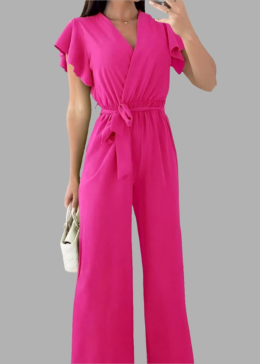 Combinaison fluide fuchsia pour femme, manches volantées et ceinture à nouer, style moderne et coloré – disponible chez Timalya.